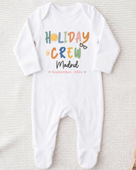A white onesie with the text "HOLIDAY CREW MADRID September. 202x" printed on it.