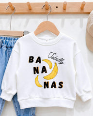 A white sweatshirt with a graphic design featuring bananas and the text " Totally bananas" printed on it.