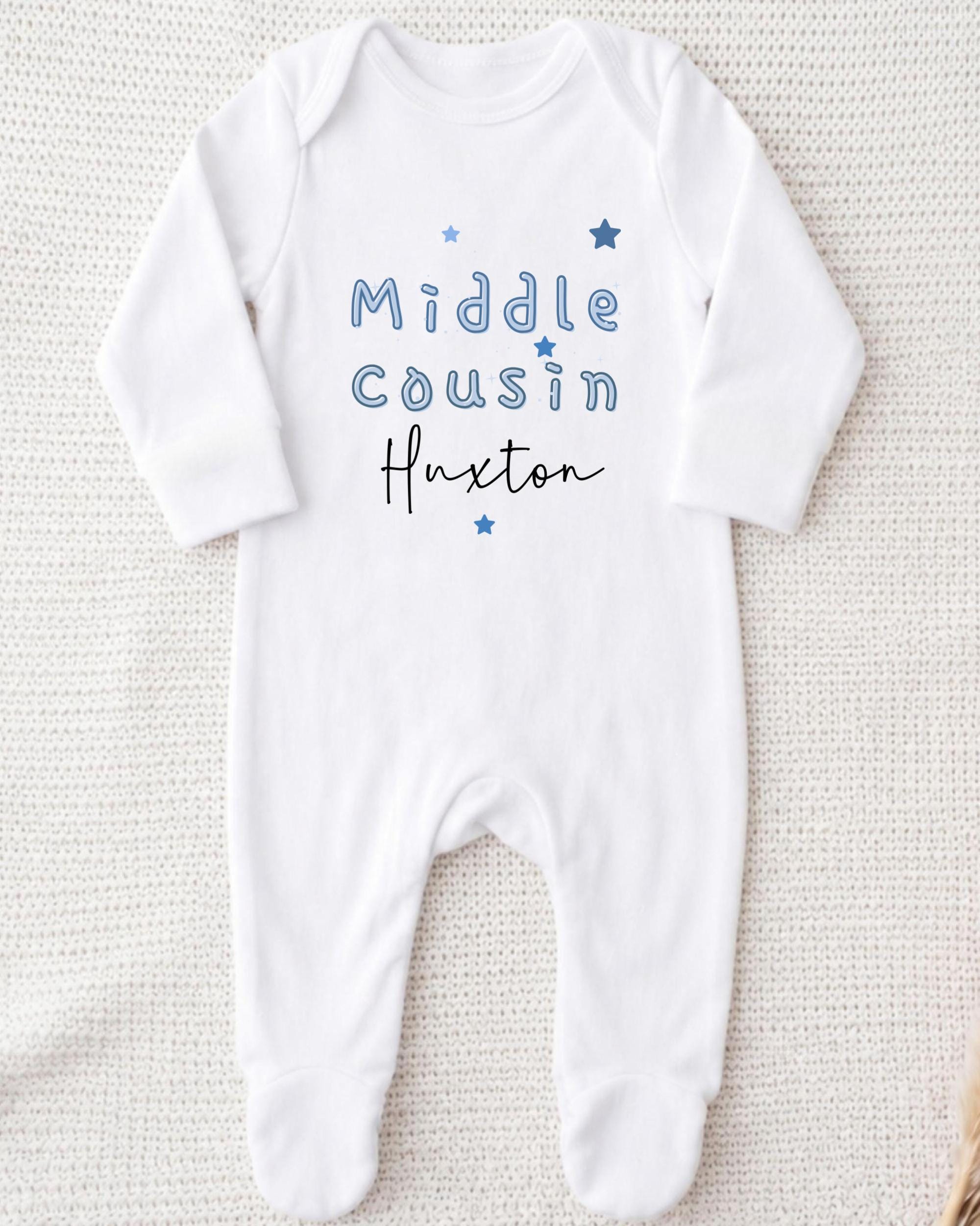 A white onesie with the text "Middle Cousin Huxton" printed on it.