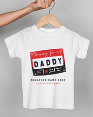 A white t-shirt with a graphic design featuring the text "Cheering for my DADDY" and "Marathon Name Here Custom Date Here" printed on it.