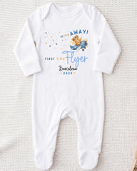 A white onesie with a printed design and text on it.