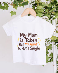 A white t-shirt with text printed on it, hanging on a wooden hanger.