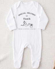 A white onesie with text and a graphic of a baby swan.