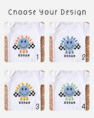 four different designs of white t-shirts, each featuring a smiling face and the text "DAD'S BEST BUD" along with the name "Rohan" below the face.