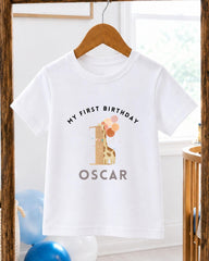 A white t-shirt with a graphic design and text printed on it, hanging on a wooden hanger.
