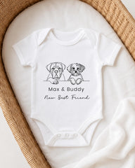 A white baby onesie with a graphic of two dogs, Max and Buddy, and the text "New Best Friend" printed on it.