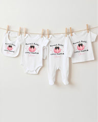 A row of four white baby clothes with the text "Mum & Dad's LITTLE PUMPIR" printed on them, along with a small pumpkin graphic.