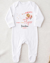 A white onesie with a graphic design and text printed on it.