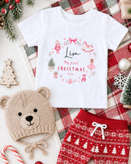A white t-shirt with a personalized message, a knitted hat, a pair of red pants, and Christmas decorations such as a Christmas tree, ornaments, and a snowflake.