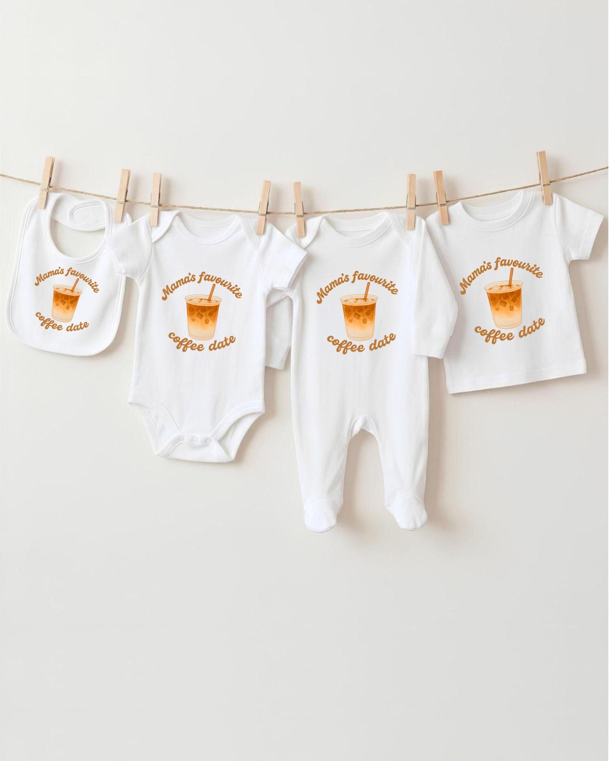 a collection of baby clothes hanging on a clothesline, with each piece featuring a coffee cup design.