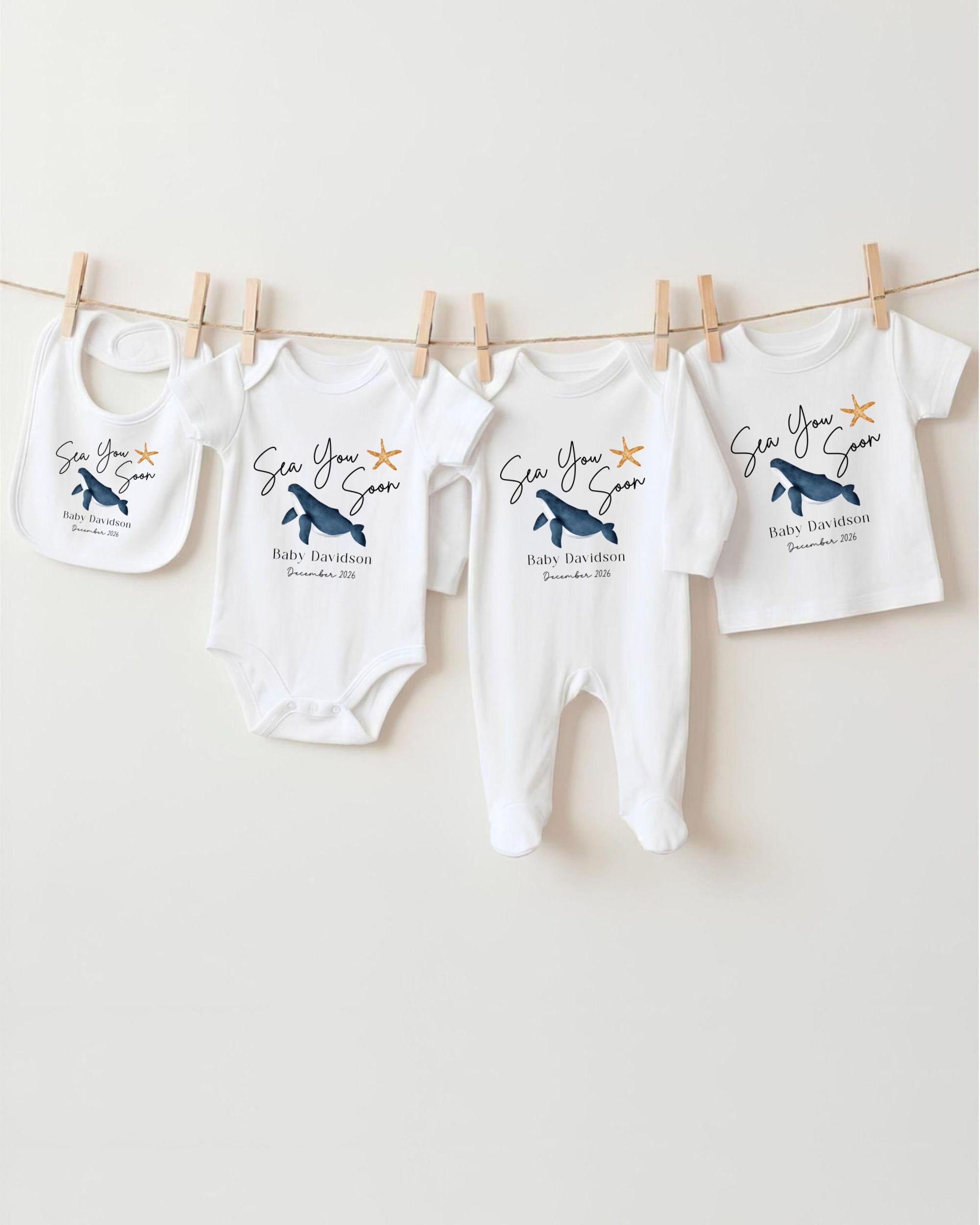 a collection of baby clothes hanging on a clothesline, with each piece featuring a unique design or pattern.