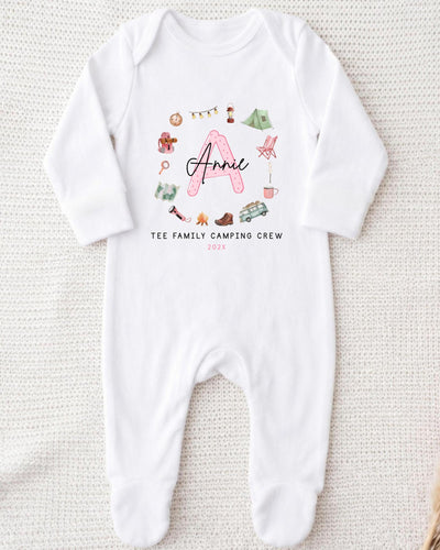 A white onesie with a personalized name and camping crew printed on it.