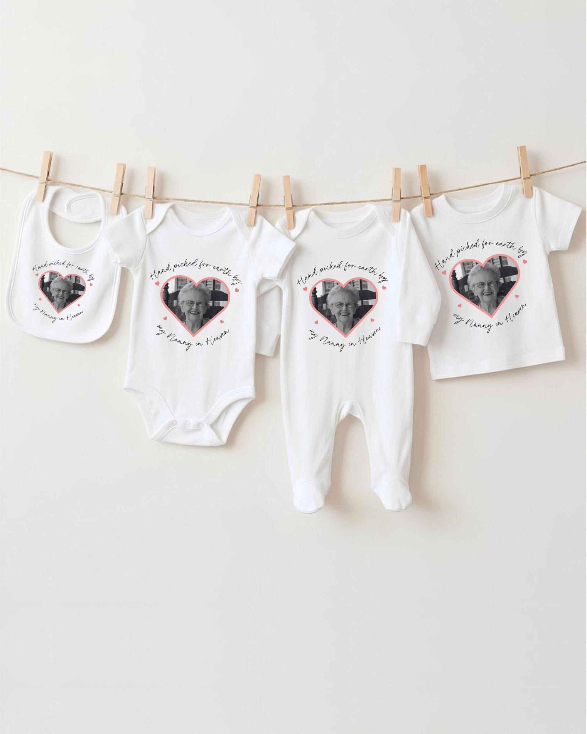 a collection of four white baby clothes hanging on a clothesline, each with a heart-shaped photo of an elderly person printed on them.