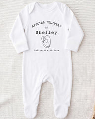 A white onesie with text and a graphic printed on it.