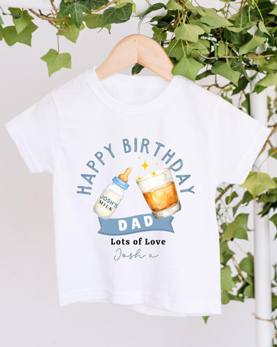 A white t-shirt with a graphic design that says "Happy Birthday Dad" and includes a bottle of milk and a glass of beer.