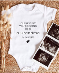 A white baby onesie with text and a graphic of baby footprints, along with a photo of an Ultrasound image, suggesting a pregnancy announcement.
