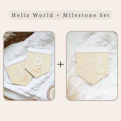 a couple of wooden tags sitting on top of a white blanket