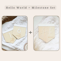 a couple of wooden tags sitting on top of a white blanket