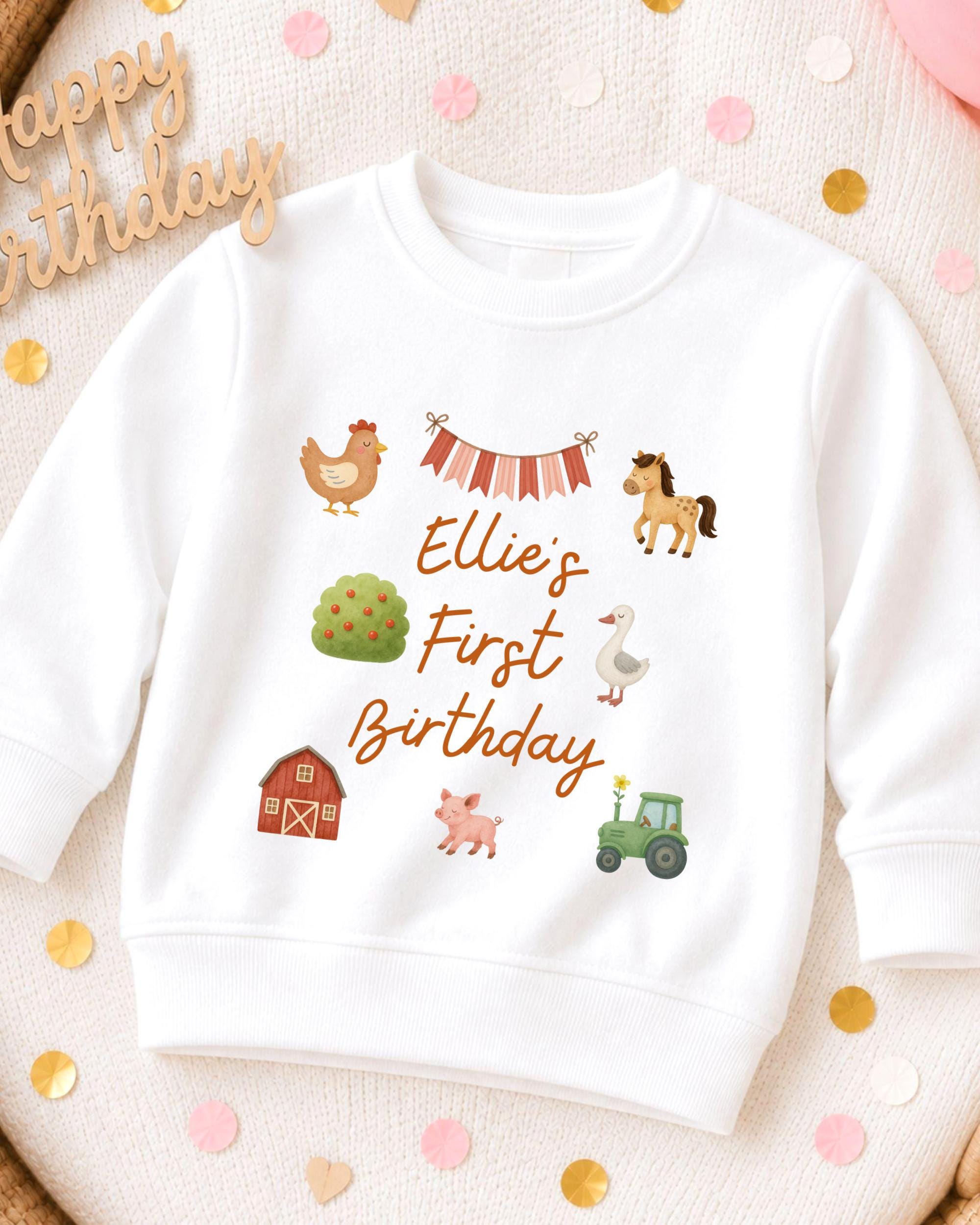 A white sweatshirt with a birthday message printed on it, surrounded by confetti.