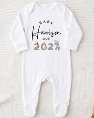 A white onesie with text and illustrations on it.