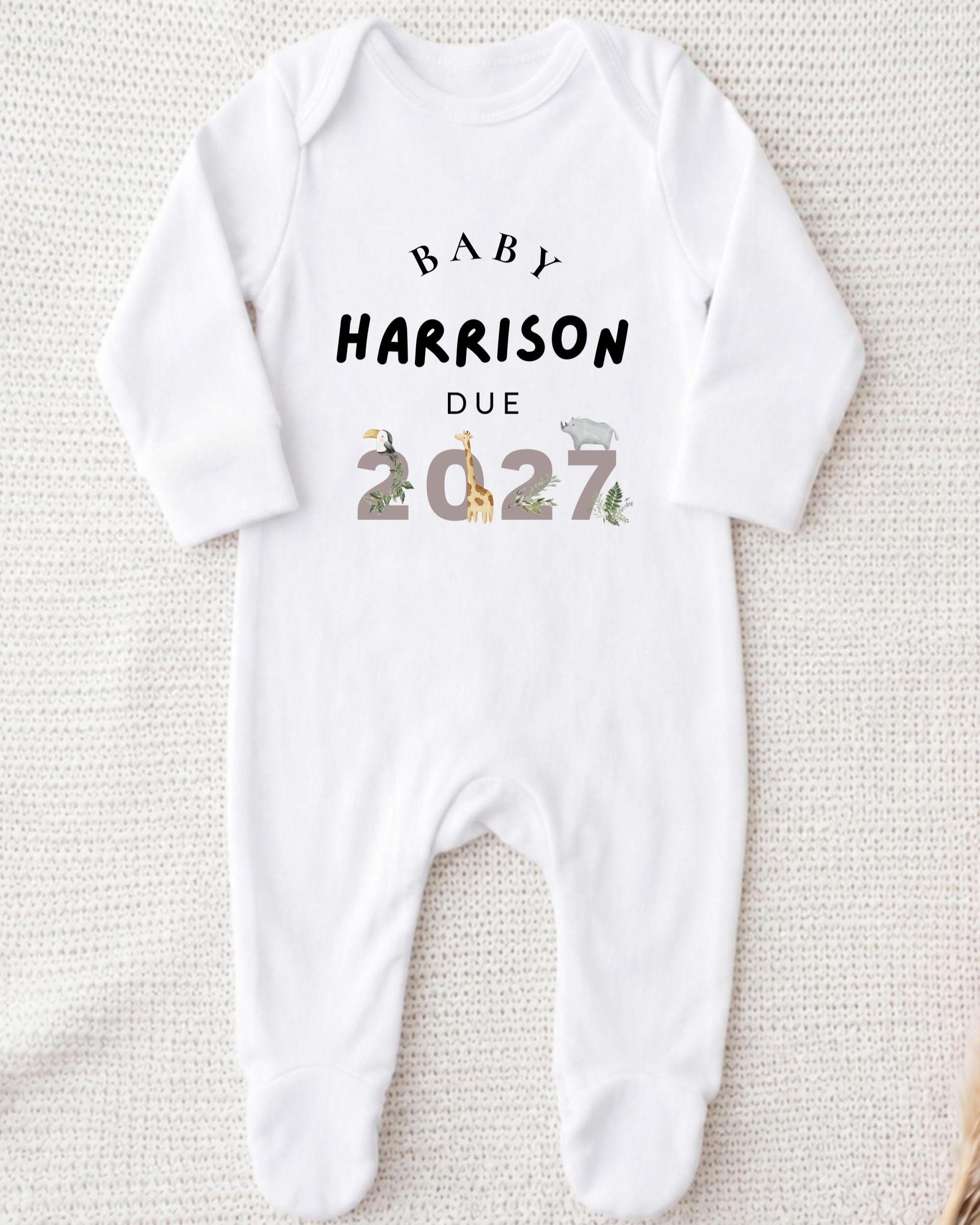 A white onesie with text printed on it.