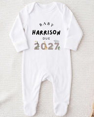 A white onesie with text printed on it.