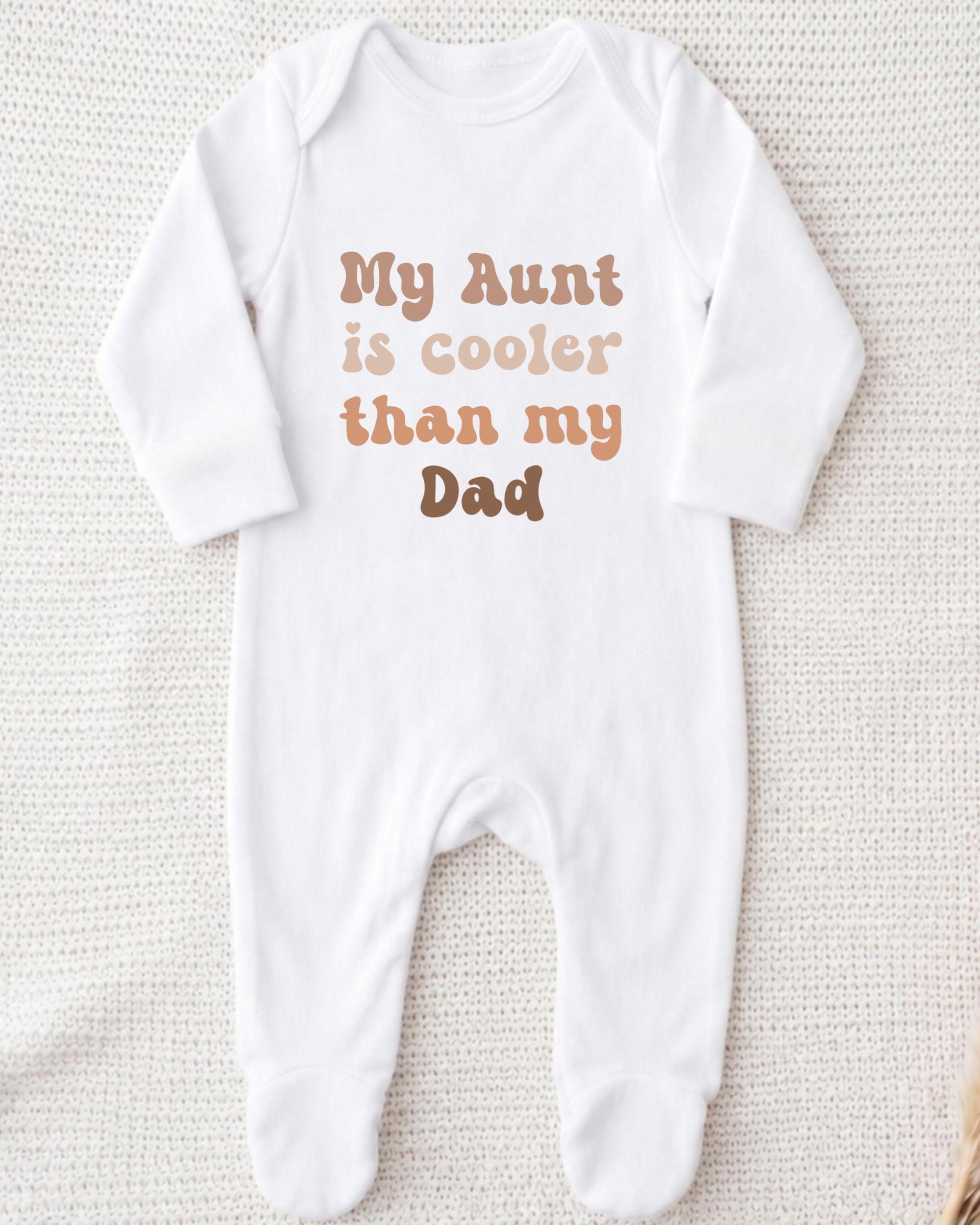 A white onesie with text printed on it.
