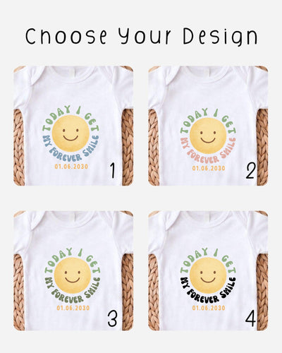 four different designs of white t-shirts with a cheerful smiley face and the text "Today I Get My Forever Smile" printed on them.