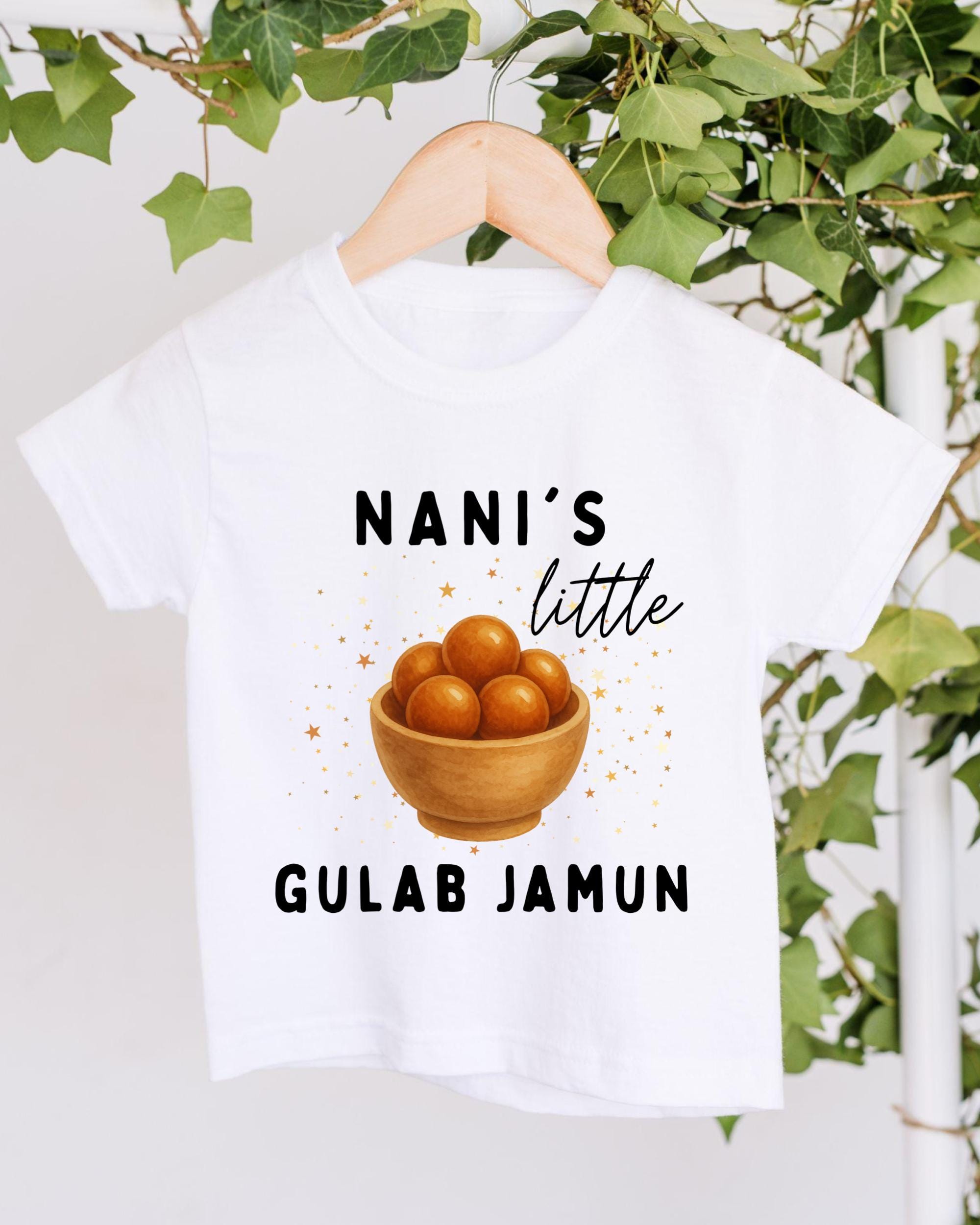 A white t-shirt with a graphic design featuring a bowl of fruit and the text "NANI'S little GULAB JAMUN" printed on it.