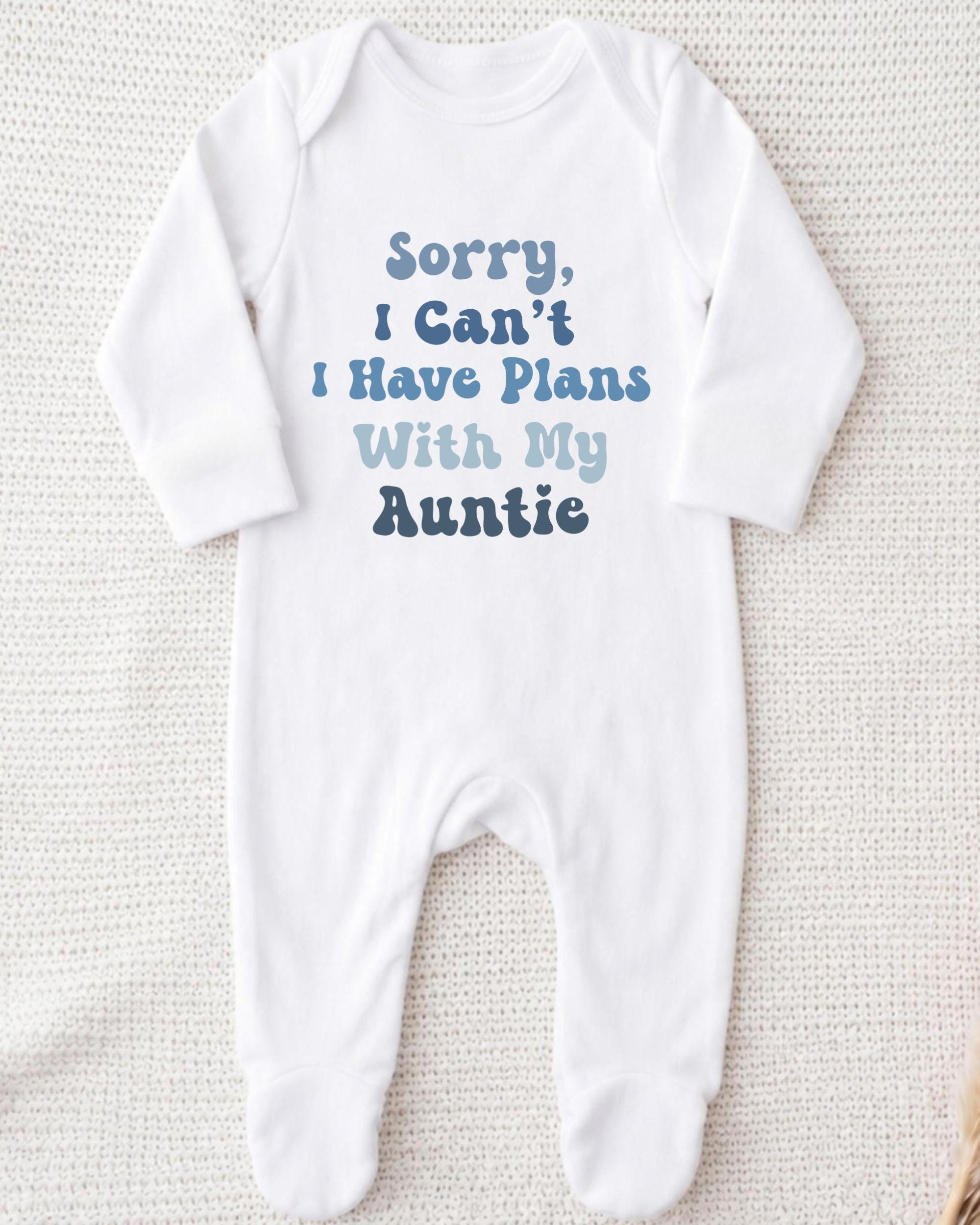 A white onesie with text printed on it.