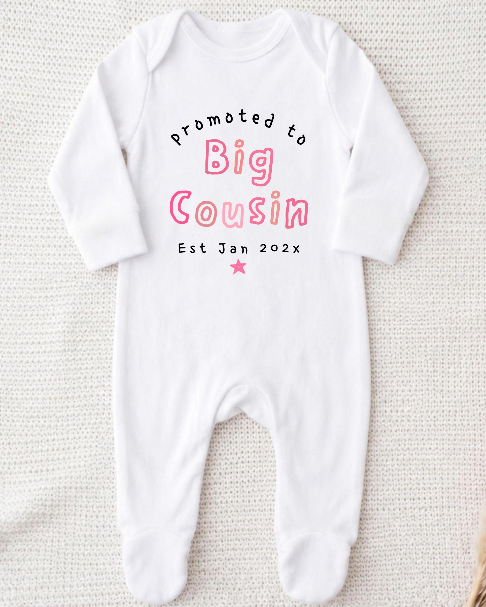A white onesie with text printed on it.