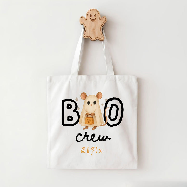 A white tote bag with a Halloween-themed design, featuring a ghost character and the text "BOO crew Alfie".