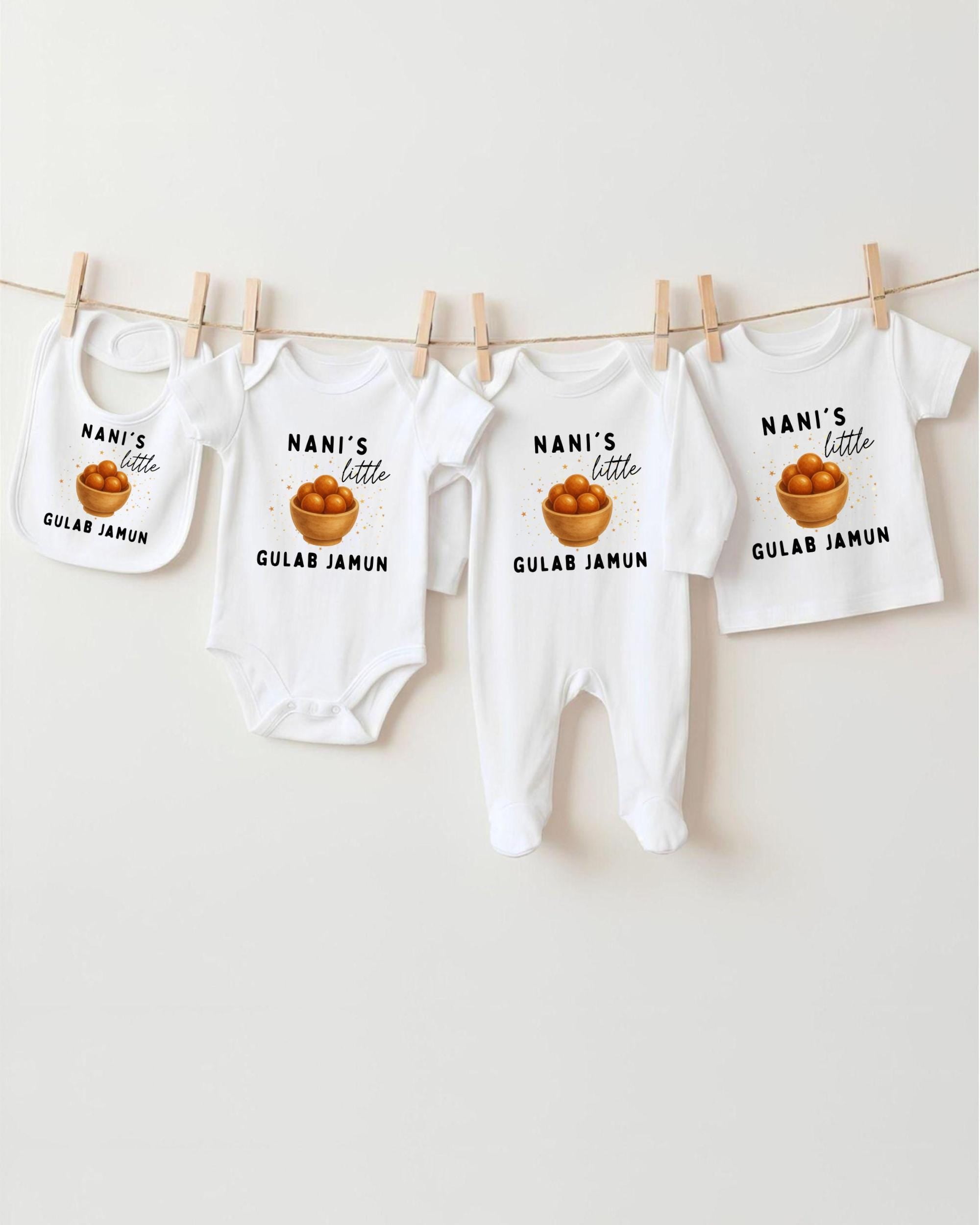 a collection of baby clothes, including bibs and onesies, hanging on a clothesline.