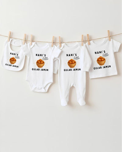 a collection of baby clothes, including bibs and onesies, hanging on a clothesline.