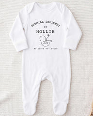 A white onesie with text and a graphic on it.