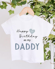 A white t-shirt with text that reads "Happy 1st Birthday as my DADDY" printed on it.