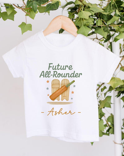 A white t-shirt with a graphic design featuring a cricket bat and the text "Future All-Rouner" and "Asher" printed on it.