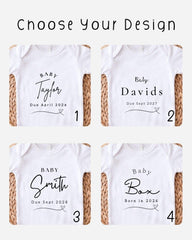 four white baby shirts with personalized text and names printed on them.