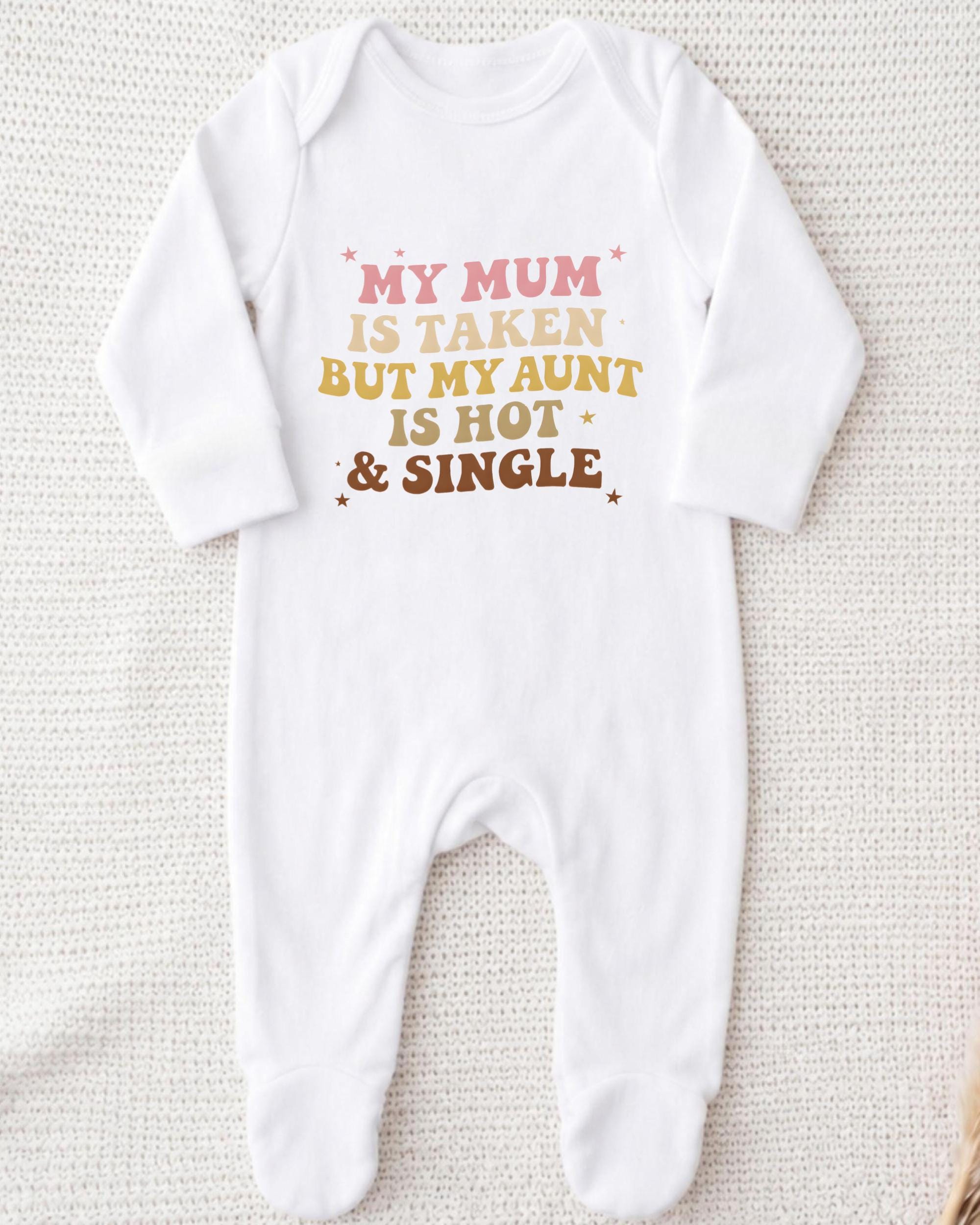 A white onesie with text printed on it.