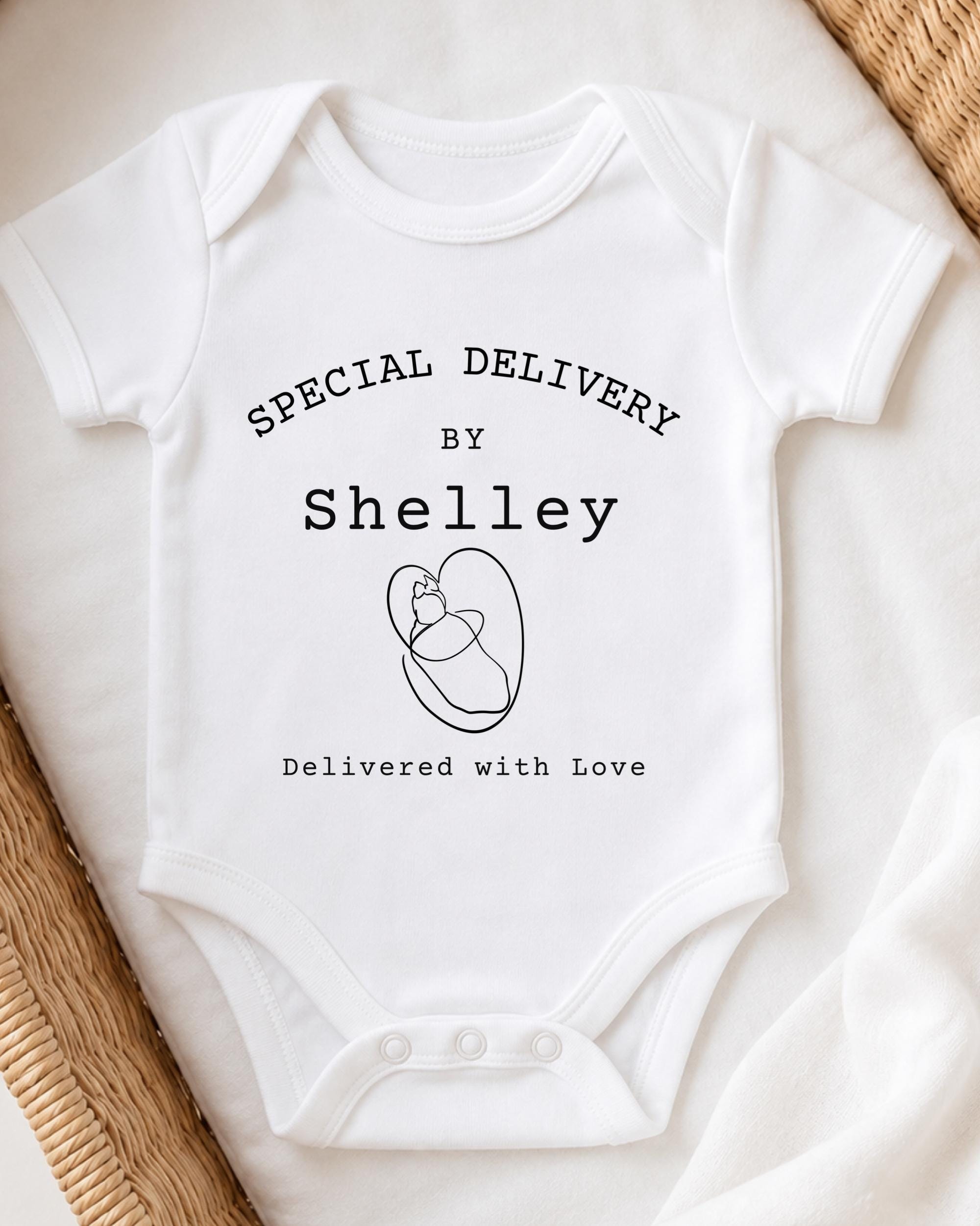 A white onesie with text and a graphic design on it.