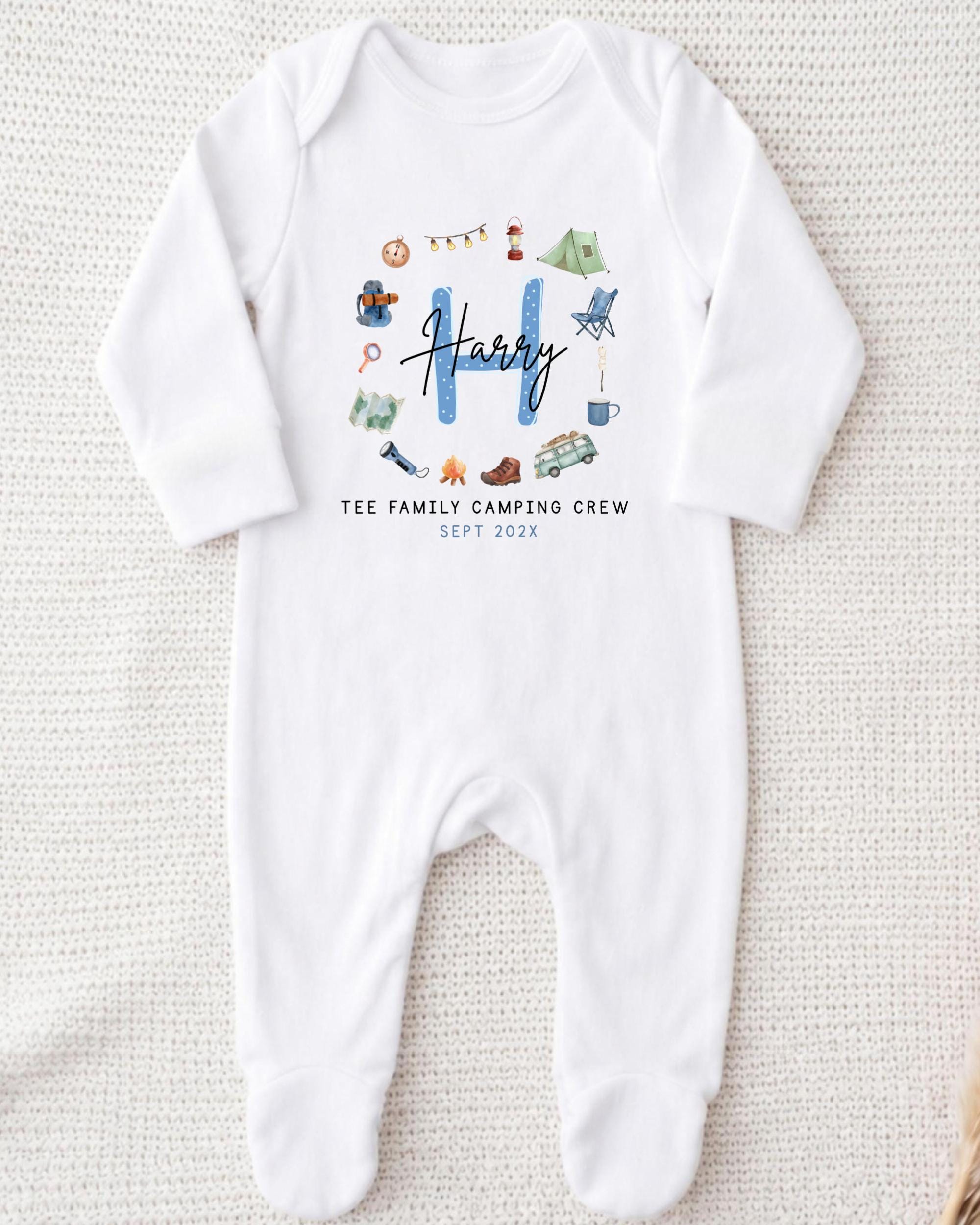 A white onesie with a personalized text and graphics printed on it.