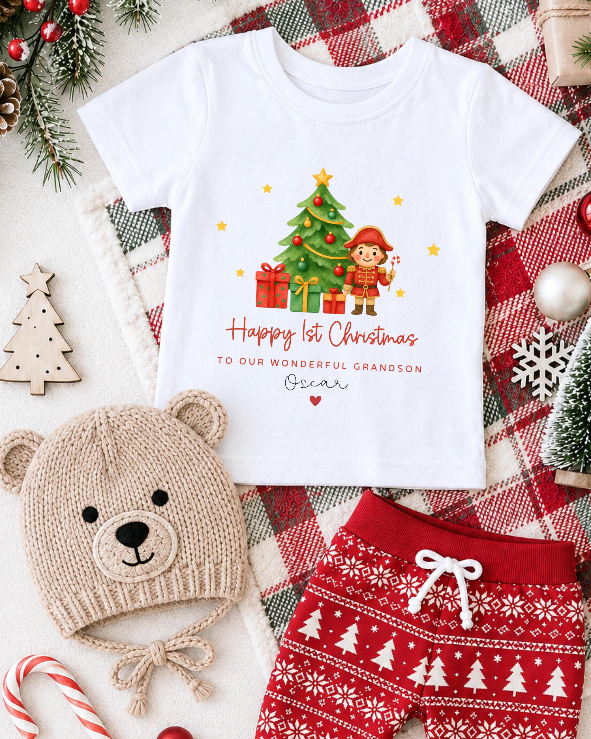 A white t-shirt with a Christmas-themed design, a beige knit hat, red and white patterned shorts, and various Christmas decorations such as a Christmas tree, ornaments, and a snowflake.