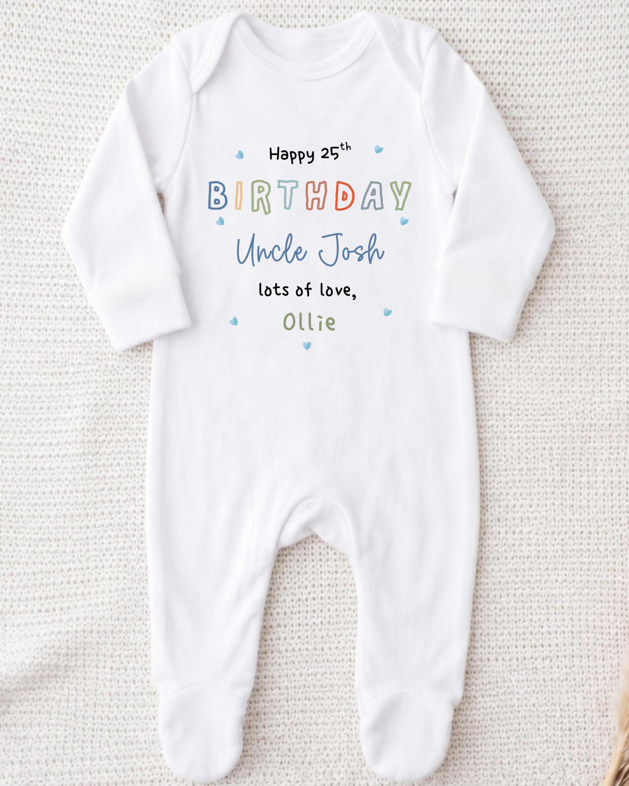 A white onesie with text printed on it, likely for a birthday celebration.