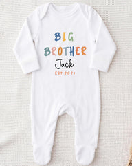 A white onesie with the text "BIG BROTHER Jack EST 2002" printed on it.
