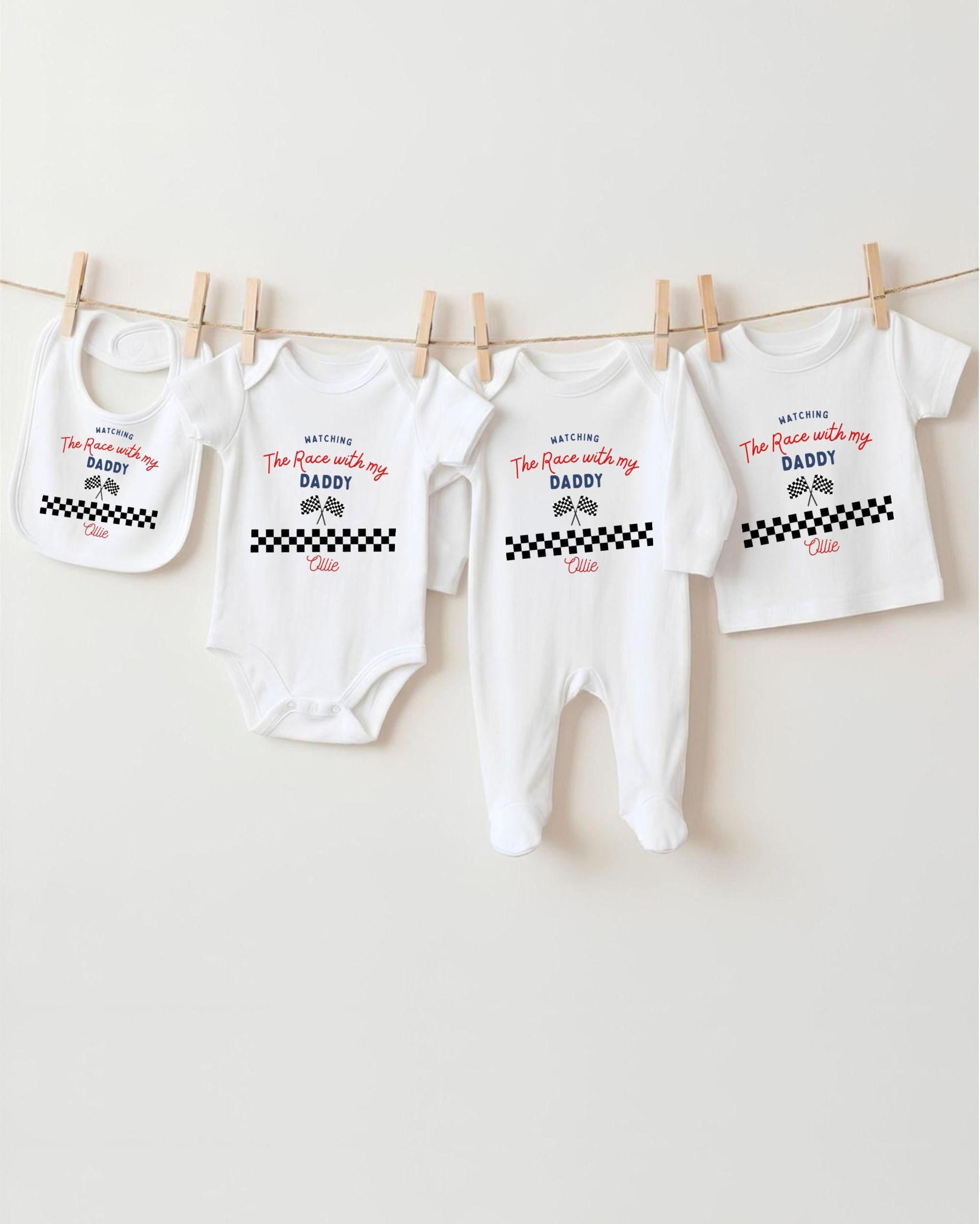 a collection of baby clothes hanging on a clothesline, with each piece featuring a personalized message.