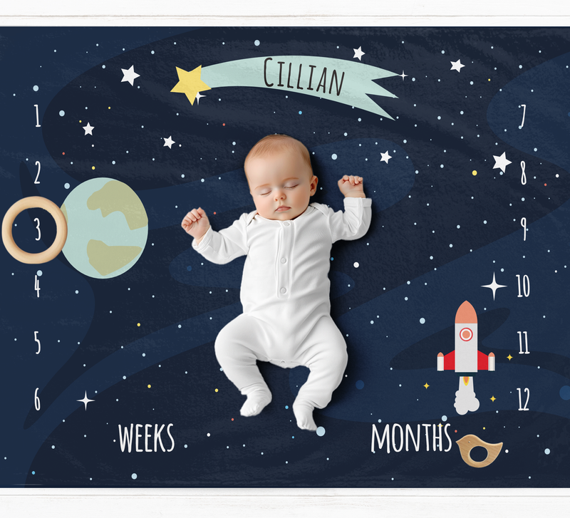 a baby in a space suit laying on the ground