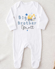 A white onesie with a blue construction vehicle and the text "Big Brother Matt" printed on it.