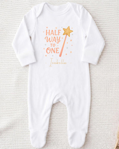 A white onesie with a printed text and a star graphic on it.