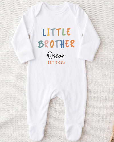 A white bodysuit with the text "Little Brother Oscar" printed on it.
