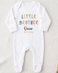 A white onesie with the text "Little Brother Oscar" printed on it.